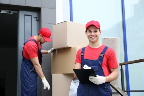 Professional movers loading items into a removals van in Streatham