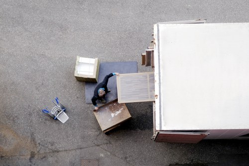 Loading household furniture into a moving van in Streatham