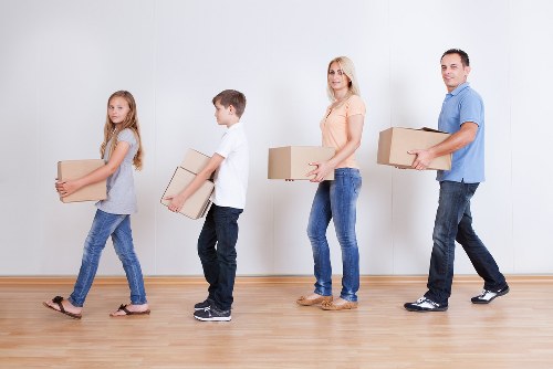 Packed boxes and furniture prepared for transport by local movers