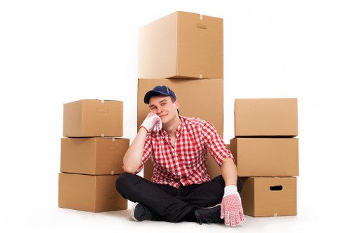 Local moving crew handling boxes and furniture for a Streatham customer