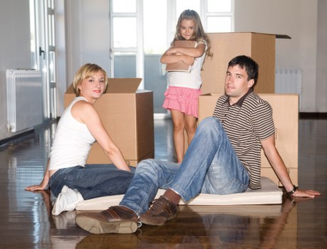 Careful lifting of a wardrobe through a narrow staircase